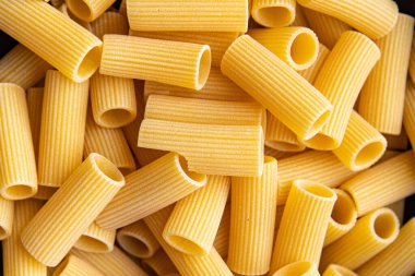 rigatoni raw pasta healthy meal food snack on the table copy space food background rustic top view