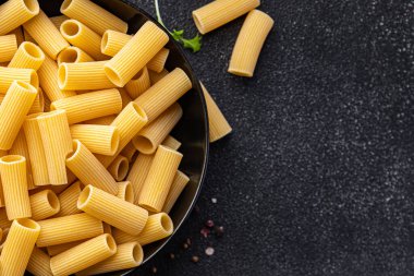 rigatoni raw pasta healthy meal food snack on the table copy space food background rustic top view