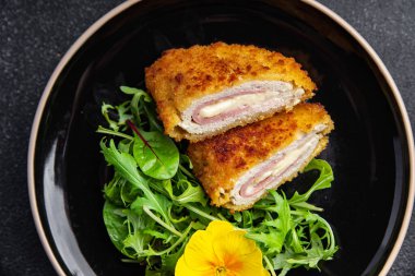 cutlet cordon bleu chicken meat, cheese, bacon healthy meal food snack on the table copy space food background rustic top view
