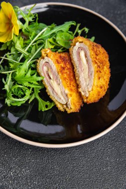 cutlet cordon bleu chicken meat, cheese, bacon healthy meal food snack on the table copy space food background rustic top view