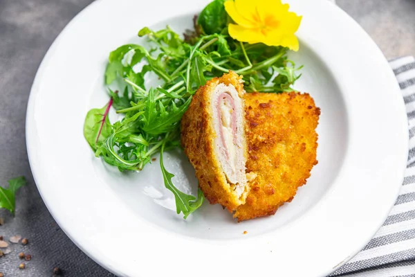 cutlet cordon bleu chicken meat, cheese, bacon healthy meal food snack on the table copy space food background rustic top view