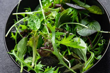 green salad leaves mix micro green, juicy healthy snack food on the table copy space food background rustic top view