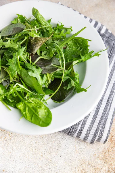 Stock image green salad leaves mix micro green, juicy healthy snack food on the table copy space food background rustic top view