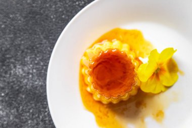 flan sweet dessert cream, caramel, lemon healthy meal food snack on the table copy space food background rustic top view