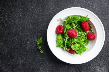 raspberry salad green leaves mix salad healthy meal food snack on the table copy space food background rustic top view keto or paleo diet veggie vegan or vegetarian food