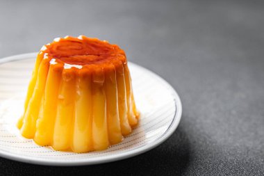 vanilla flan caramel sauce sweet dessert cream caramel meal food snack on the table copy space food background rustic top view