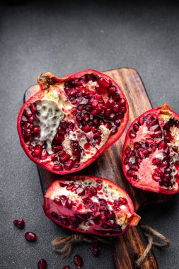 pomegranate fruit fresh red sweet berry meal food snack on the table copy space food background rustic top view keto or paleo diet veggie vegan or vegetarian food