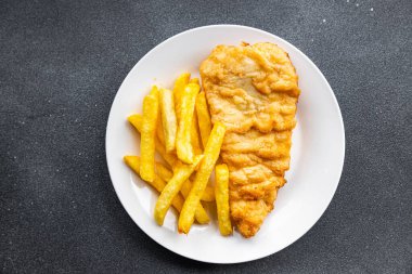 fish and chips french fries deep fried fast food takeaway healthy meal food snack on the table copy space food background rustic top view