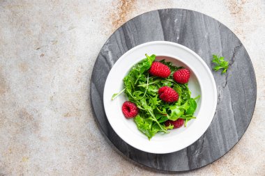 fresh raspberry salad green leaves mix salad healthy meal food snack on the table copy space food background rustic top view