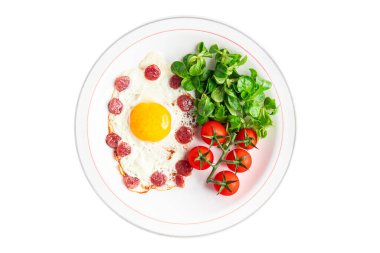 breakfast fried egg sausage, vegetable fresh meal snack on the table copy space food background rustic top view