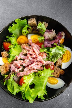 cup of coffee and spring flowers primrose multicolored on the table copy space food background rustic top view