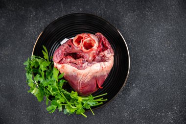 heart raw offal pork or beef healthy meal food snack on the table copy space food background rustic top view keto or paleo diet