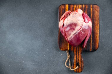 heart raw offal pork or beef healthy meal food snack on the table copy space food background rustic top view keto or paleo diet