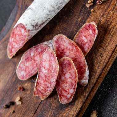sausage Fuet cured meat  meal food snack on the table copy space food background rustic top view