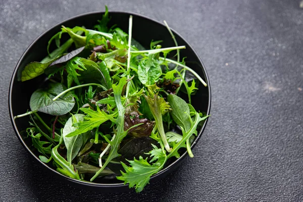 stock image green salad leaves mix mix micro green, healthy snack food on the table copy space food background rustic top view