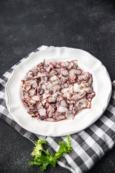 octopus carpaccio marinated seafood salad healthy meal food snack on the table copy space food background rustic top view