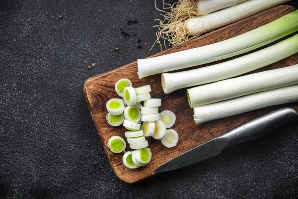 stock image leeks cut into pieces fresh vegetable healthy meal food snack on the table copy space food background rustic top view keto or paleo diet veggie vegan or vegetarian food