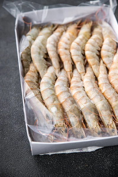 stock image gambas raw frozen in ice big shrimp seafood prawn meal food snack pescatarian diet on the table copy space food background rustic top view keto or paleo