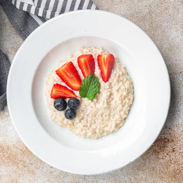 stock image oatmeal porridge breakfast berries healthy meal food snack on the table copy space food background rustic top view