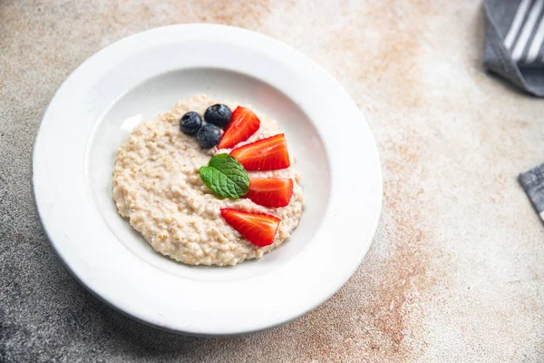 stock image oatmeal porridge breakfast berries healthy meal food snack on the table copy space food background rustic top view