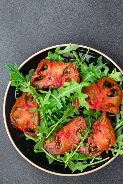 stock image salad tomato arugula healthy meal food snack on the table copy space food background rustic top view keto or paleo diet veggie vegan or vegetarian food