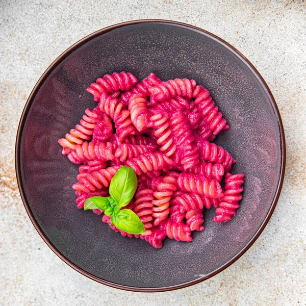 stock image pasta fusilli beet vegetable sauce beetroot second course fresh food vegan meal food snack vegetarian food on the table copy space food background rustic top view