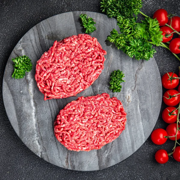 raw meat cutlet fresh ground meat beef, pork, chicken meal food snack on the table copy space food background rustic top view