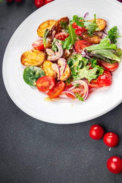 stock image potato salad and vegetable baked potato, tomato, onion, salad leaves, salad dressing vinaigrette vegetables food healthy meal food snack on the table copy space food background rustic top view 