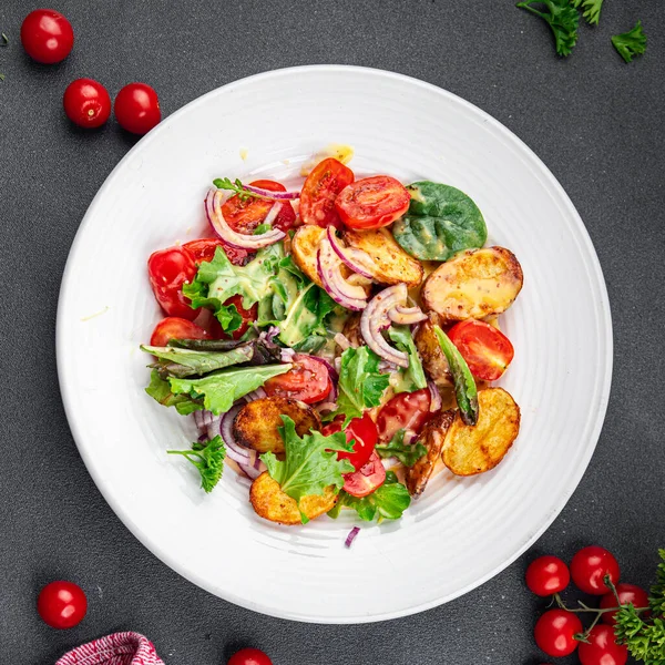 potato salad baked vegetable potato, tomato, onion, salad leaves vegetables food healthy meal food snack on the table copy space food background rustic top view