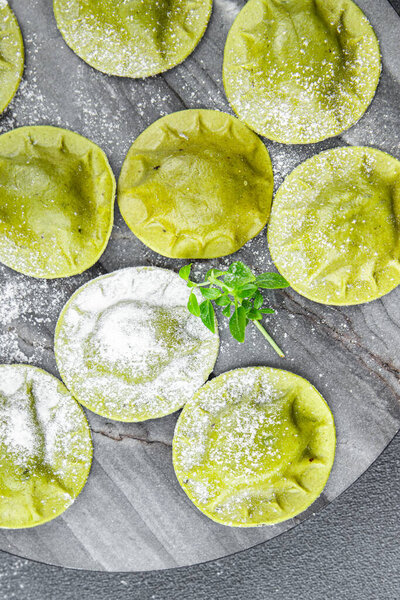 green ravioli fresh green dough  spinach, basil vegetable food meal food snack on the table copy space food background rustic top view