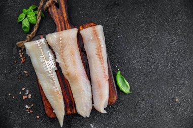 Mavi mezgitli balık fileto taze deniz ürünleri lezzetli sağlıklı Pescetarian yemek aperatifler masa üzerinde fotokopi uzay yiyecek arka plan kırsal üst görünüm