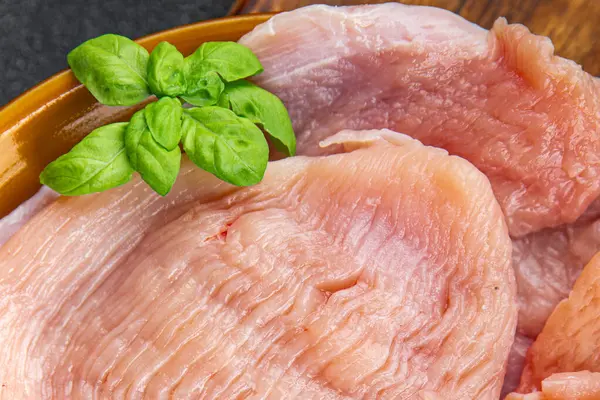raw turkey fillet fresh poultry meat slice diet healthy eating cooking appetizer meal food snack on the table copy space food background rustic top view