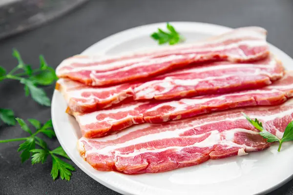 bacon slices fresh meat product pork eating cooking appetizer meal food snack on the table copy space food background rustic top view