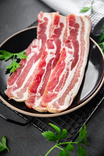 bacon slices fresh meat product pork eating cooking appetizer meal food snack on the table copy space food background rustic top view