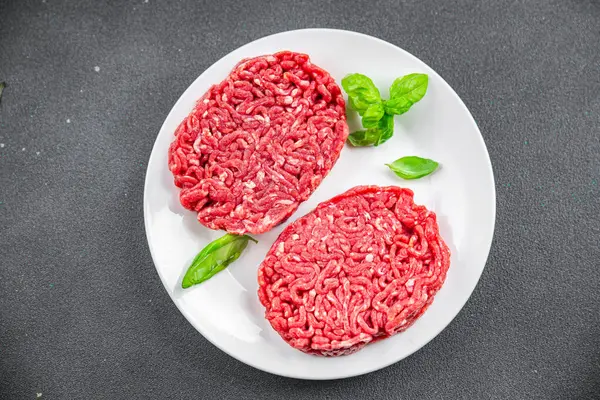 ground meat raw cutlet fresh beef meat hamburger eating cooking appetizer meal food snack on the table copy space food background rustic top view