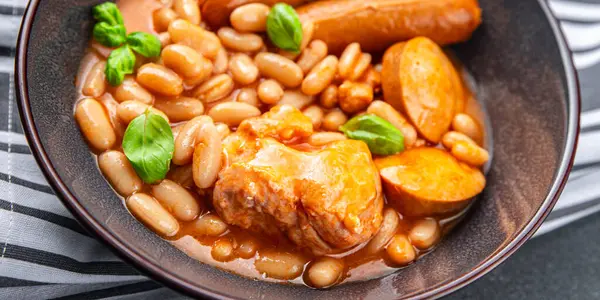 cassoulet dish  thick bean soup meat, bean, sausage delicious eating cooking appetizer meal food snack on the table copy space