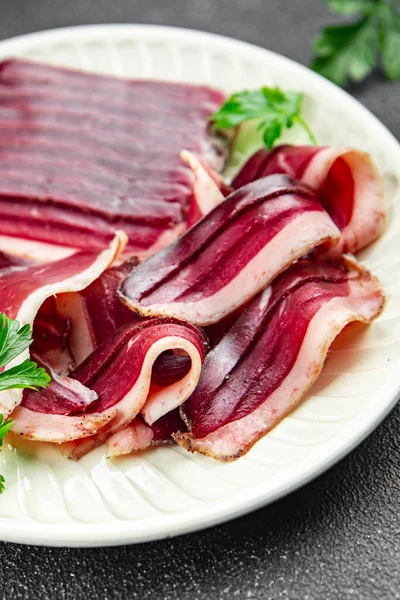 duck breast dried meat magret smoked jerky cured dried poultury fresh appetizer meal food snack on the table copy space food background rustic top view