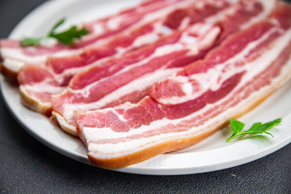 bacon slice fresh meat pork eating appetizer meal food snack on the table copy space food background rustic top view