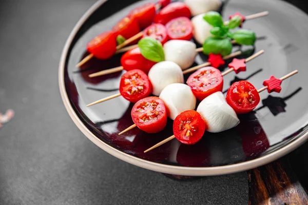 stock image Caprese mozzarella tomato appetizer salad skewer finger food eating cooking appetizer meal food snack on the table copy space food background rustic top view