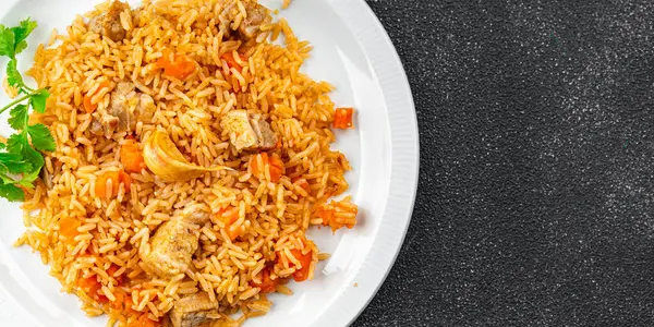 rice with meat tasty pilaf with fresh pork meat healthy eating cooking appetizer meal food snack on the table copy space food background rustic top view