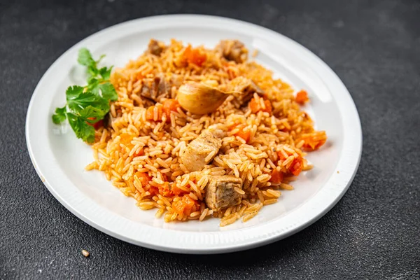 rice with meat tasty pilaf with fresh pork meat healthy eating cooking appetizer meal food snack on the table copy space food background rustic top view