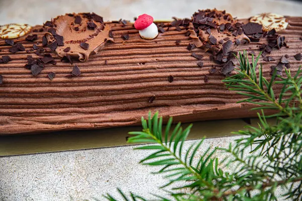 christmas log sweet roll chocolate biscuit christmas sweet dessert holiday baking treat new year and christmas celebration meal food snack on the table copy space food background rustic top view