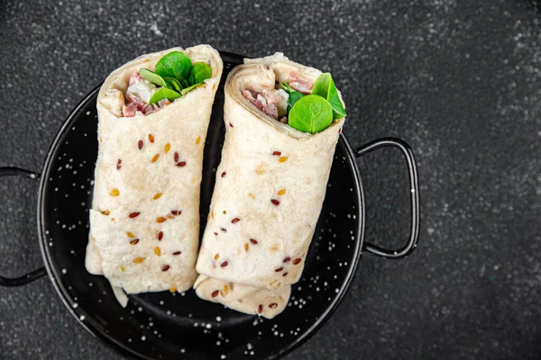 tortilla wrap ham, vegetable, cheese, lettuce delicious fresh tasty healthy eating cooking appetizer meal food snack on the table copy space food background rustic top view