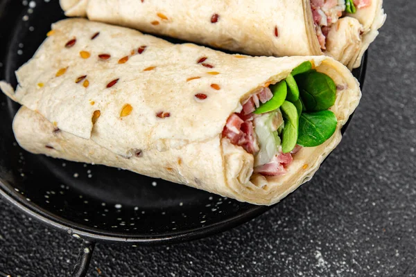 tortilla wrap ham, vegetable, cheese, lettuce delicious fresh tasty healthy eating cooking appetizer meal food snack on the table copy space food background rustic top view