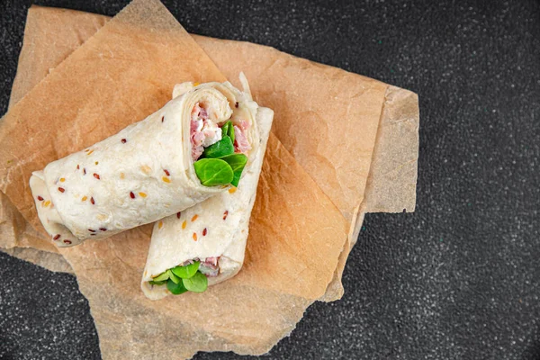 tortilla wrap ham, vegetable, cheese, lettuce delicious fresh tasty healthy eating cooking appetizer meal food snack on the table copy space food background rustic top view
