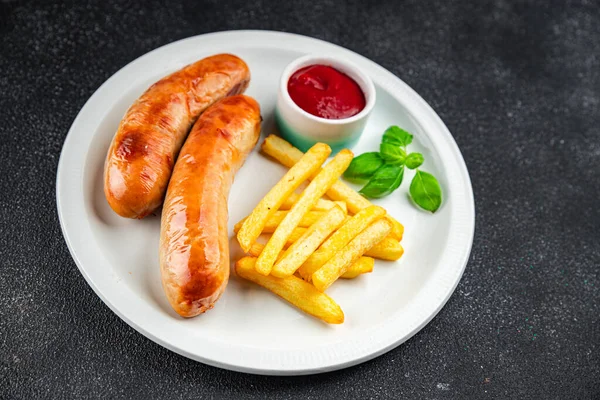 fried sausages and french fries fast food meat and potatoes tasty fresh eating cooking appetizer meal food snack on the table copy space food background rustic top view
