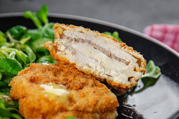 chicken meat cutlet cordon bleu snack ham, cheese fresh meal food on the table copy space food background rustic top view