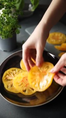 salad tomato yellow slice Cooking appetizer meal food snack on the table copy space food background rustic top view 