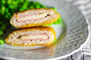 meat cutlet cordon bleu chicken, cheese, bacon meal snack on the table copy space food background rustic top view