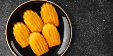 Madeleine, tatlı bisküvi, Noel kurabiyesi. Masanın üzerinde taze lezzetli gurme yemek arkaplanı.